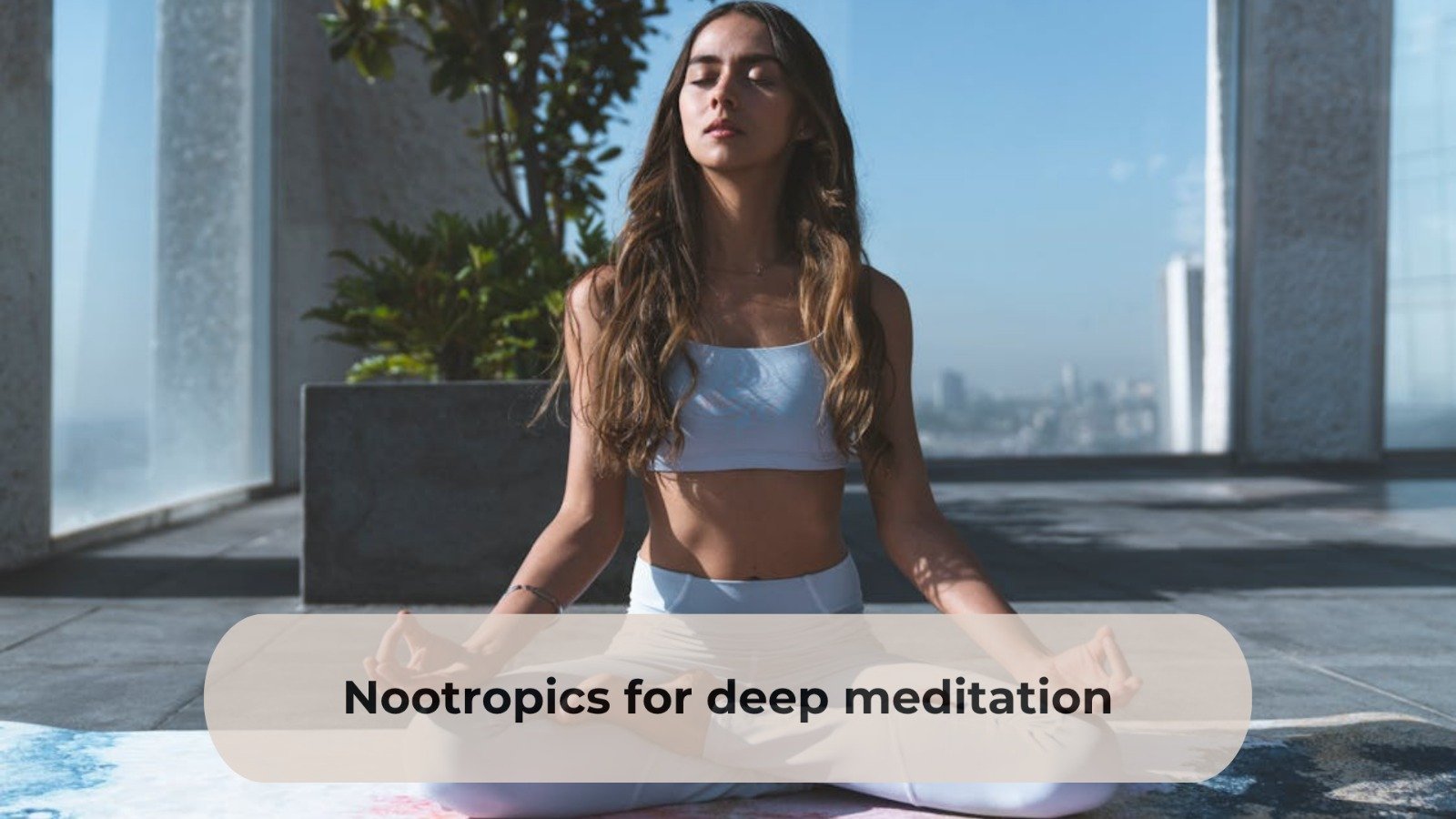 A young woman meditating in a seated pose on a rooftop with city views, practicing deep breathing and mindfulness under natural sunlight.